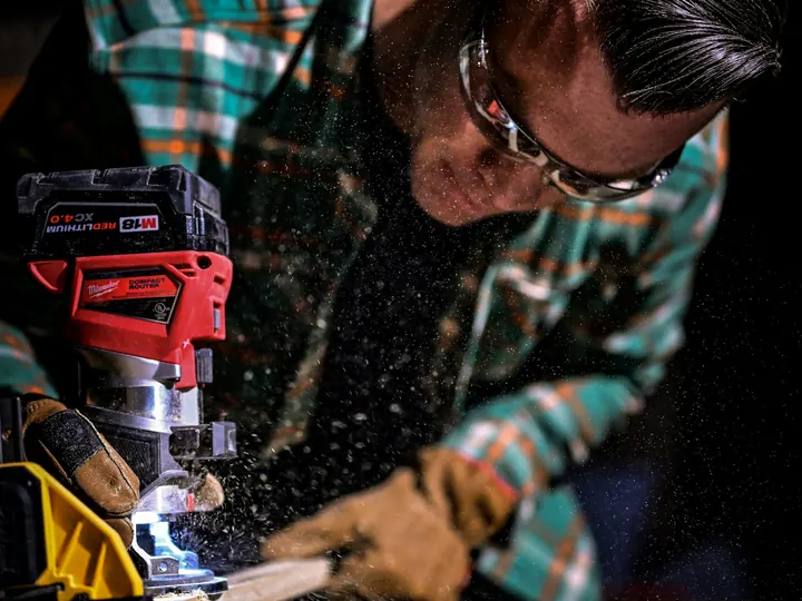 Carpenter cutting timber